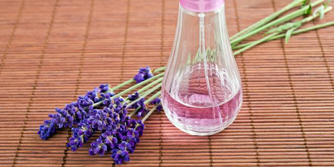  lavender flowers and a spritzer bottle of homemade hydrosol